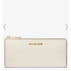 Never used. New. White Micheal Kors Wallet.